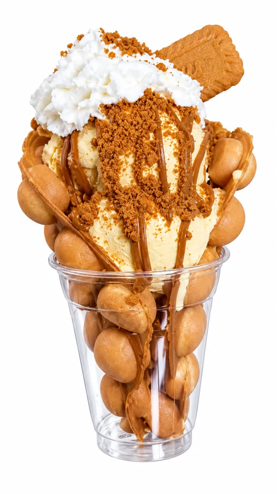 Finished Michoacanita Biscoff bubble waffle with vanilla ice cream, Biscoff topping, whipped cream and cookie